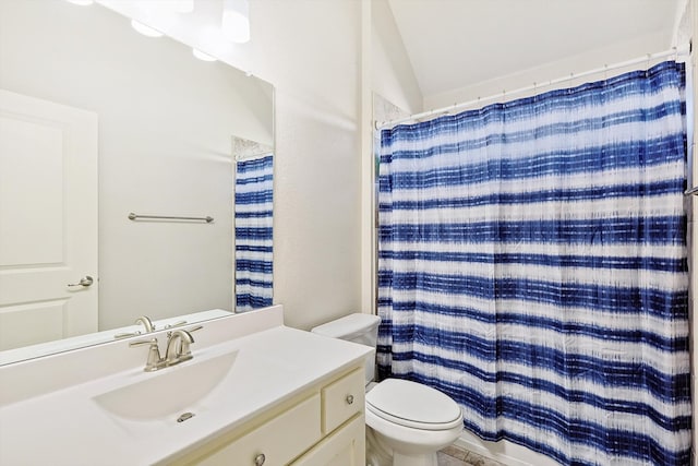 bathroom featuring toilet, lofted ceiling, a shower with curtain, and vanity