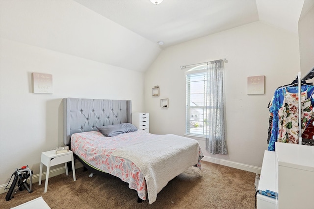 carpeted bedroom featuring lofted ceiling