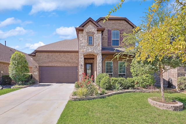 view of front of house with a front lawn and a garage