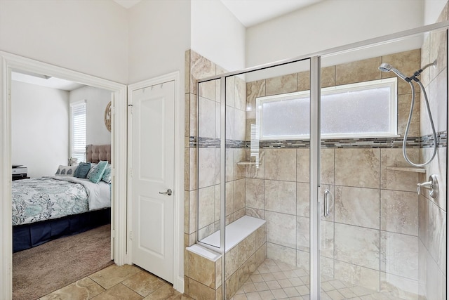 bathroom featuring walk in shower, plenty of natural light, and tile patterned flooring