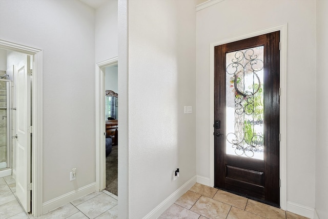 entryway with light tile patterned floors