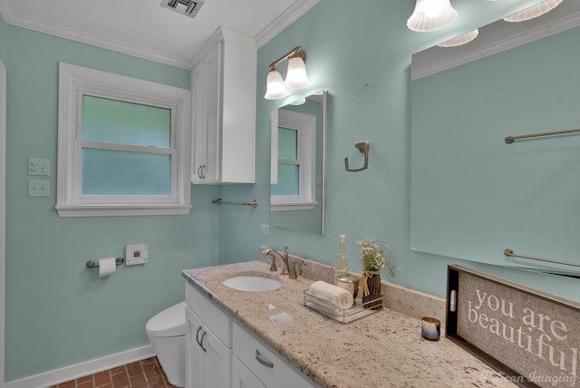 bathroom featuring vanity, toilet, and ornamental molding