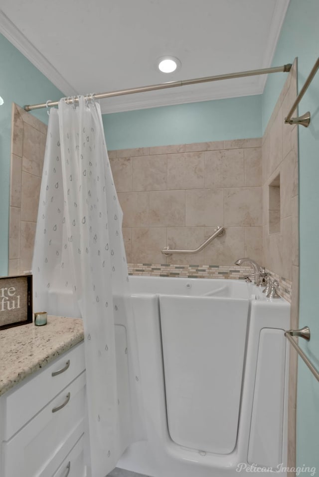 bathroom with vanity, crown molding, and separate shower and tub