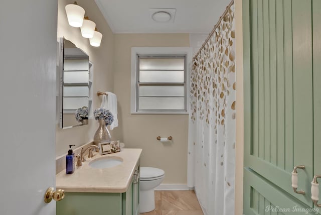 bathroom featuring vanity, toilet, and a shower with shower curtain