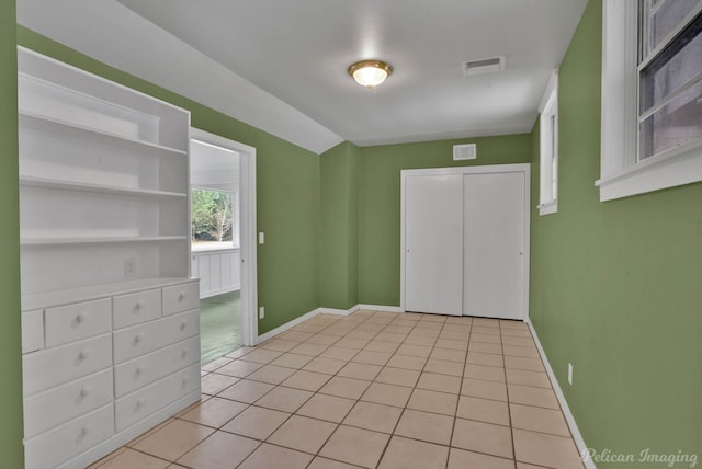 spare room with light tile patterned floors