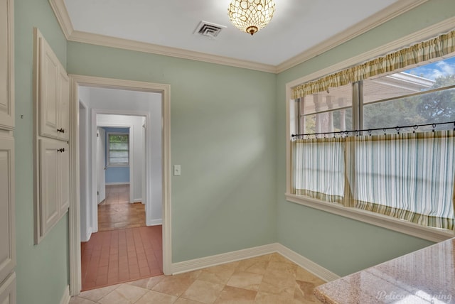 interior space featuring ornamental molding, light tile patterned floors, and plenty of natural light