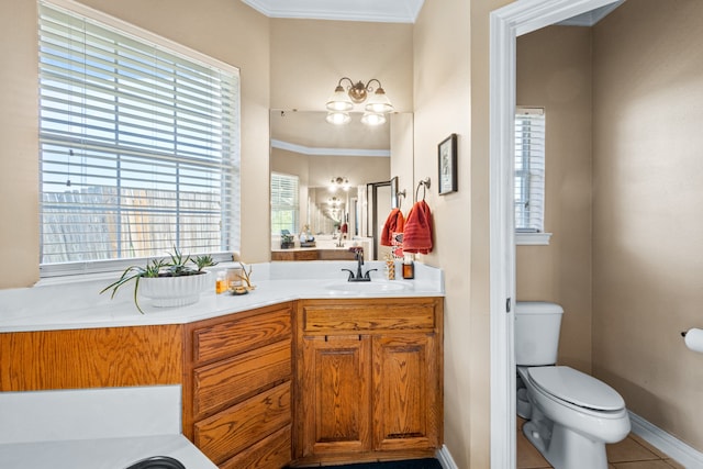 bathroom featuring crown molding, tile patterned flooring, vanity, and toilet