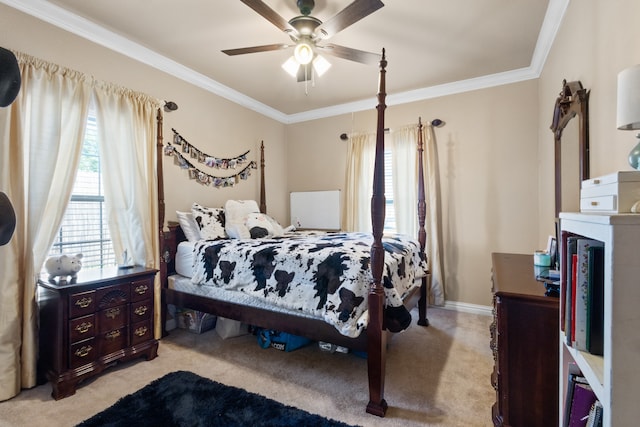 carpeted bedroom with ceiling fan and crown molding