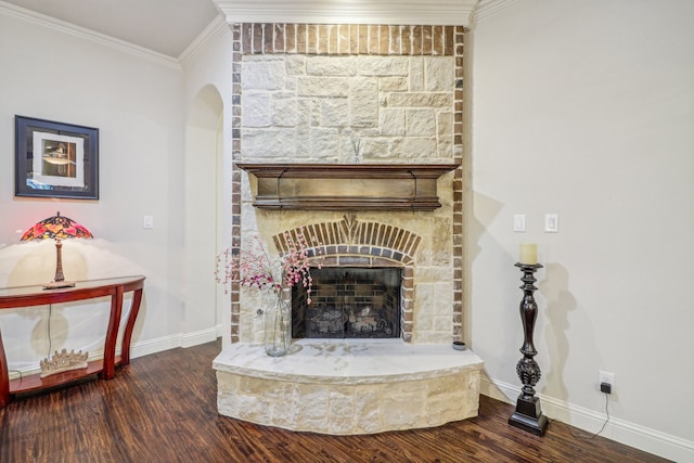 interior details with a fireplace, hardwood / wood-style flooring, and ornamental molding