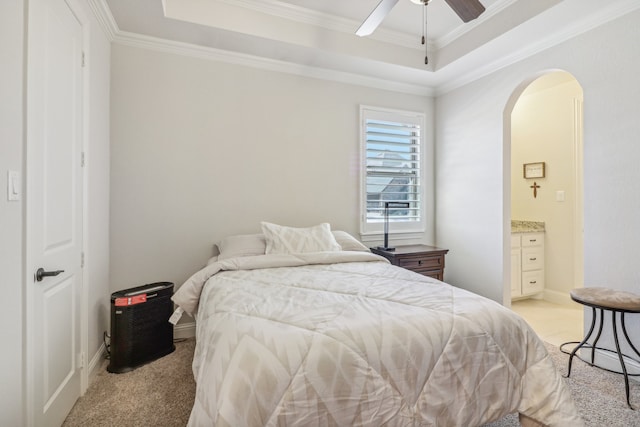 bedroom featuring ceiling fan, light colored carpet, and ornamental molding