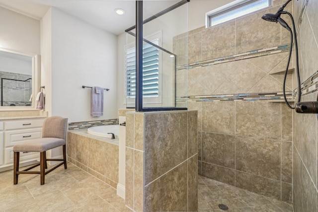 bathroom with separate shower and tub and tile patterned flooring