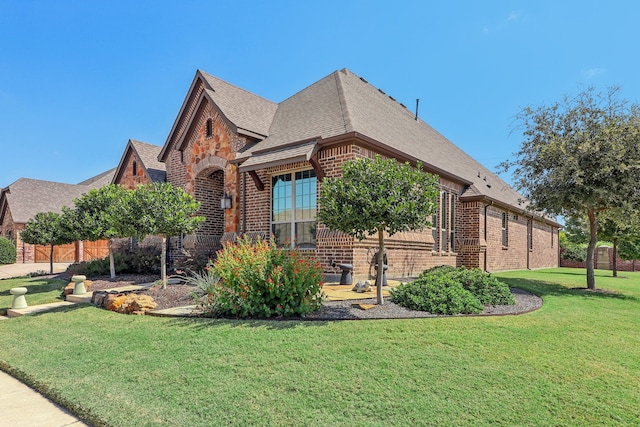 tudor house with a front yard