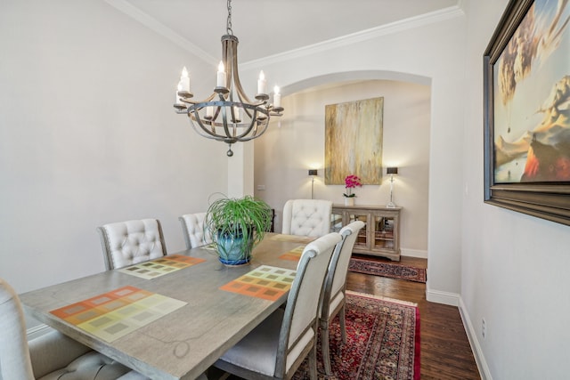 dining area with ornamental molding and dark wood-type flooring