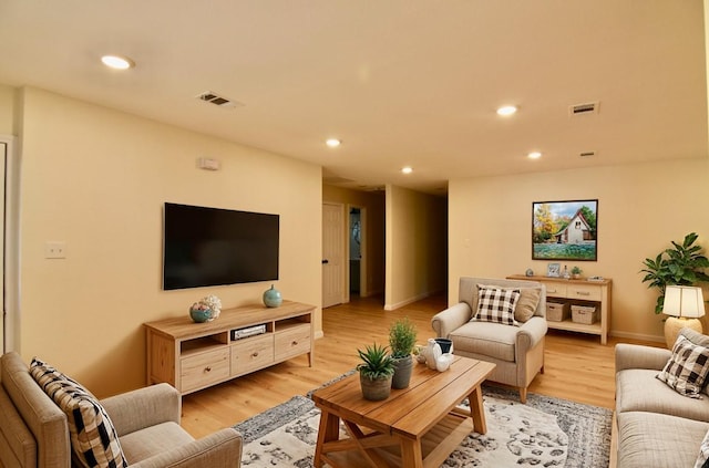 living room with light hardwood / wood-style flooring