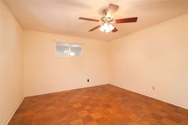 empty room featuring parquet flooring, crown molding, and ceiling fan