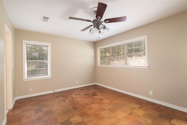 unfurnished room with ceiling fan