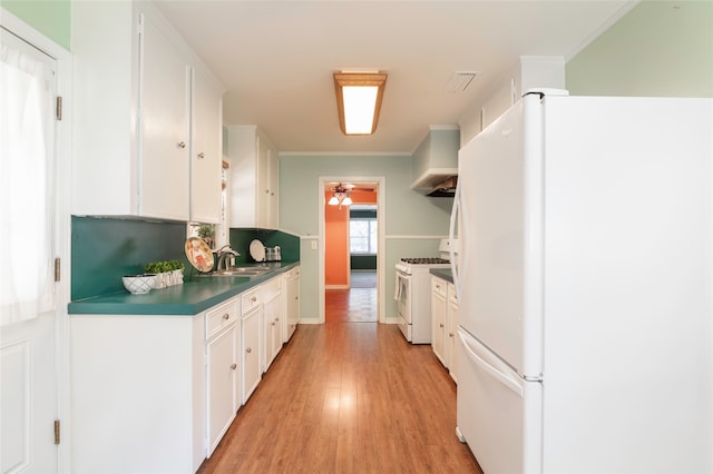 kitchen featuring light wood-type flooring, crown molding, white appliances, and white cabinetry