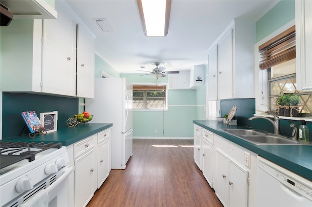 kitchen featuring sink, white cabinets, white appliances, dark hardwood / wood-style flooring, and ceiling fan