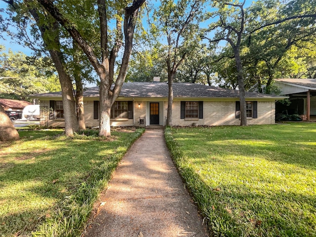 ranch-style home with a front yard