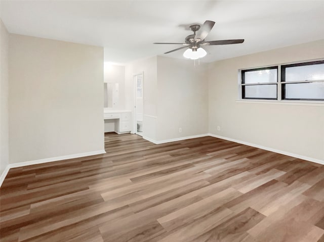 spare room with ceiling fan and hardwood / wood-style floors