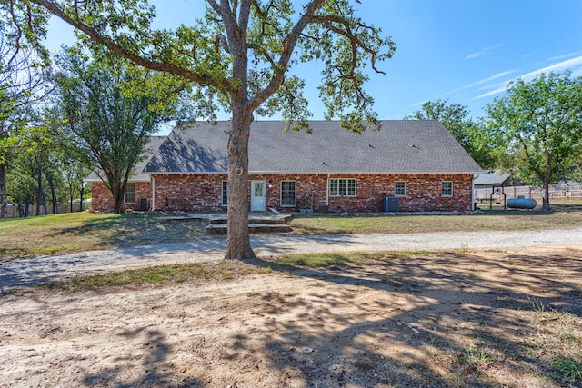 back of house featuring central AC unit