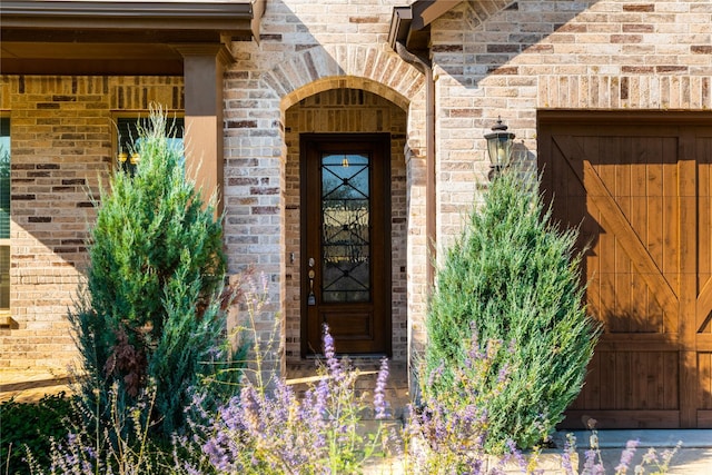 entrance to property with brick siding