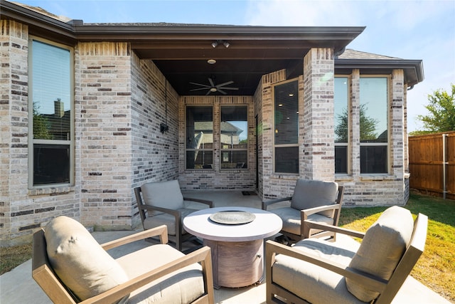 view of patio featuring a fire pit and ceiling fan