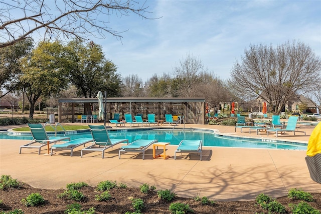 view of swimming pool featuring a patio area