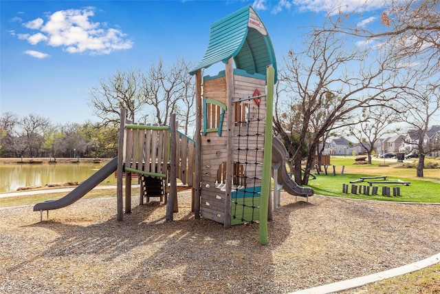 view of playground with a water view and a yard