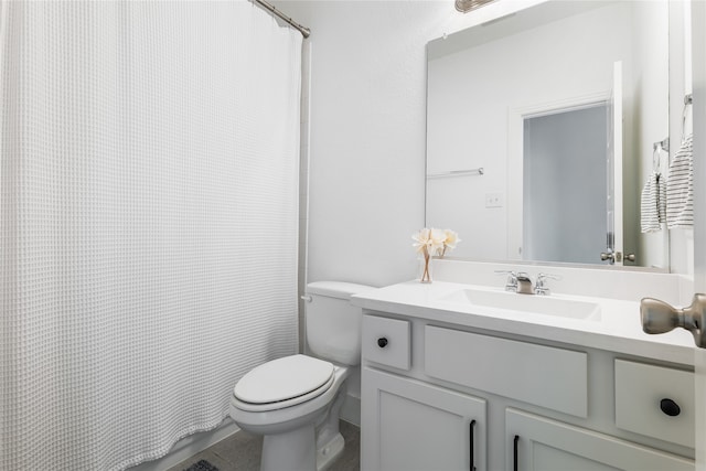 bathroom with tile patterned floors, vanity, and toilet