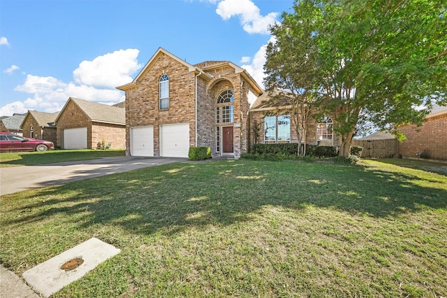 view of front property featuring a garage and a front lawn