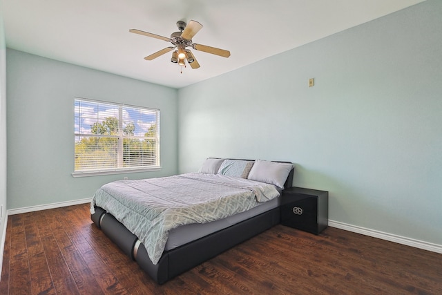 bedroom featuring ceiling fan and dark hardwood / wood-style floors