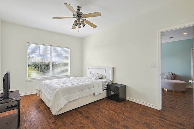 bedroom featuring ceiling fan and dark wood-type flooring