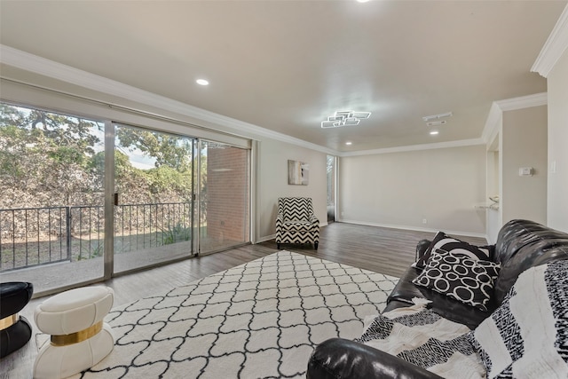 living room featuring ornamental molding and wood-type flooring