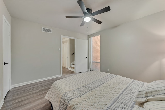 bedroom featuring hardwood / wood-style floors and ceiling fan