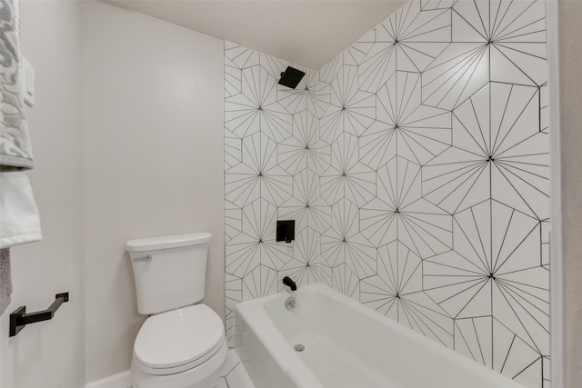 bathroom featuring shower / bathtub combination and toilet