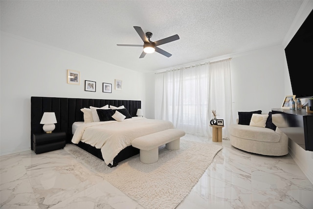 bedroom featuring ceiling fan and a textured ceiling