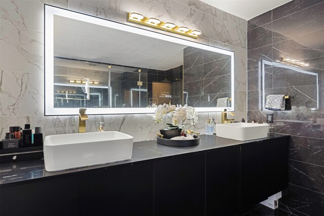 bathroom with tile walls and vanity