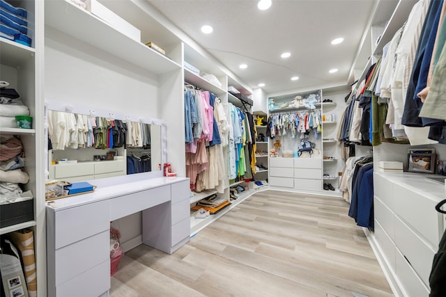 walk in closet featuring light hardwood / wood-style flooring