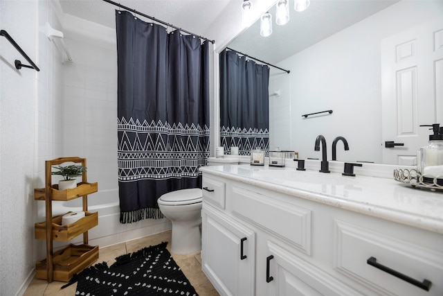 full bathroom featuring shower / bath combo with shower curtain, vanity, a textured ceiling, toilet, and tile patterned floors