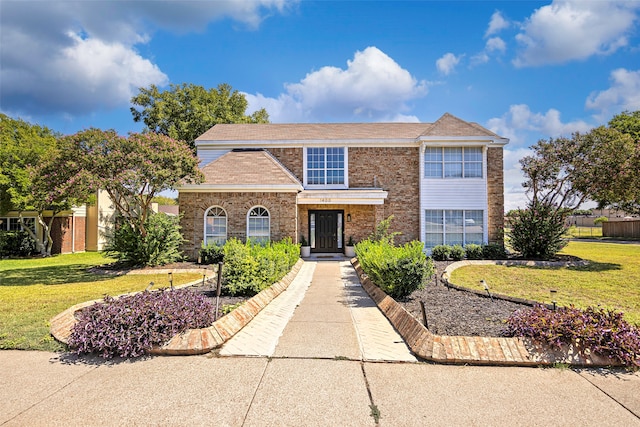 view of front of property with a front lawn