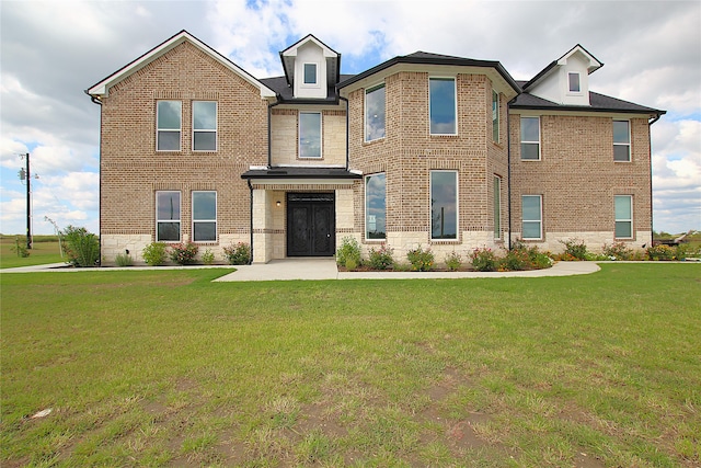 view of front of home featuring a front lawn