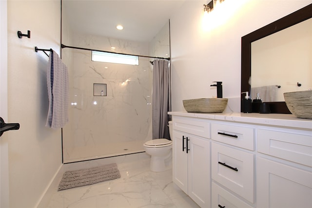 bathroom with vanity, toilet, and curtained shower