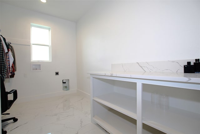 laundry room featuring washer hookup and electric dryer hookup