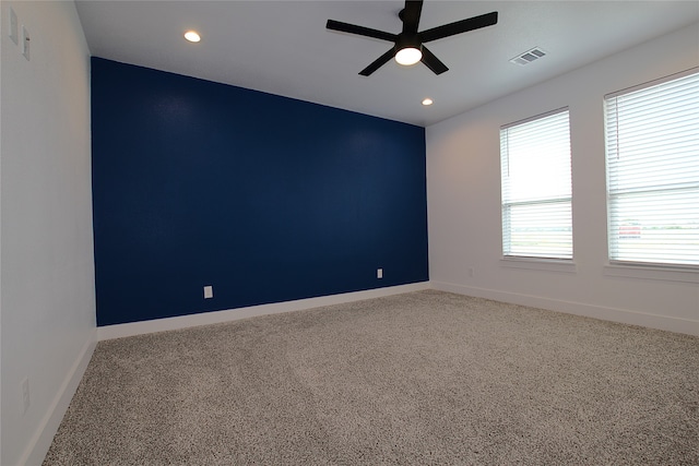 carpeted empty room with ceiling fan