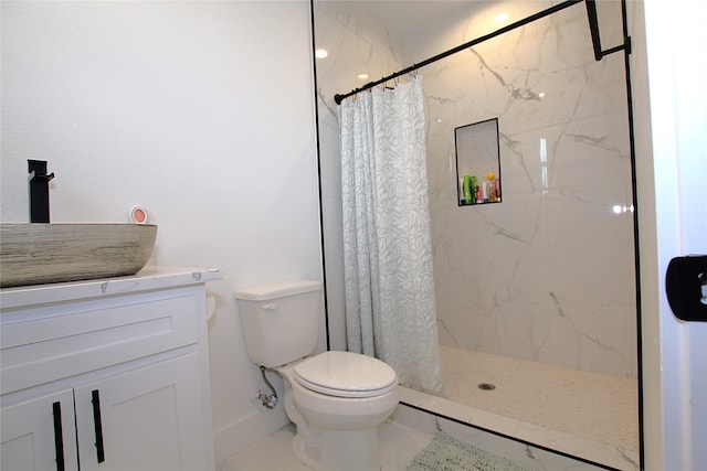 bathroom with walk in shower, vanity, toilet, and tile patterned floors