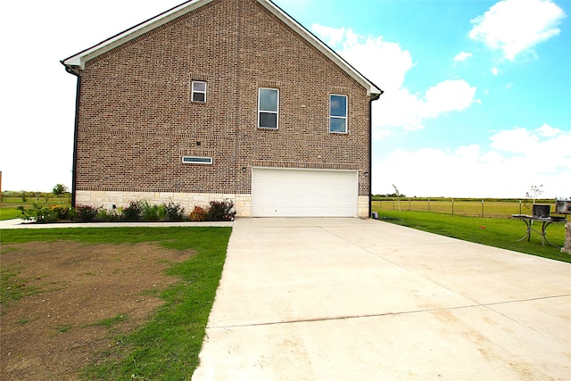 view of property exterior with a garage and a yard