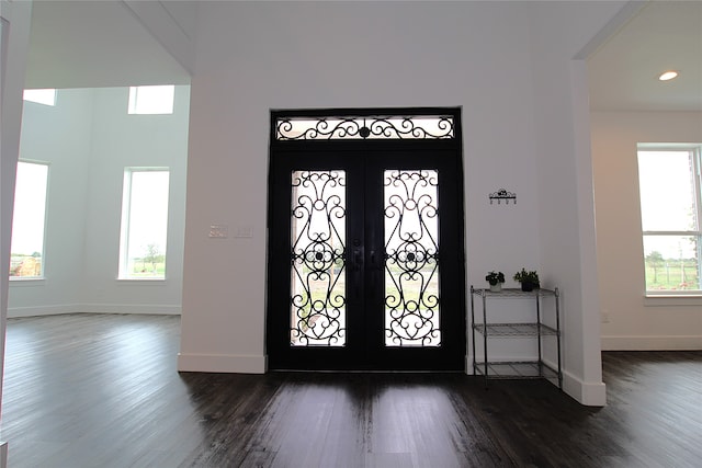 entryway featuring french doors and dark hardwood / wood-style flooring