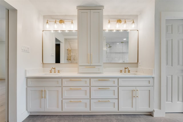 bathroom featuring vanity, a shower, and tile patterned flooring