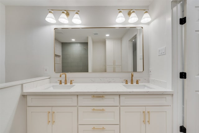 bathroom featuring vanity and a tile shower